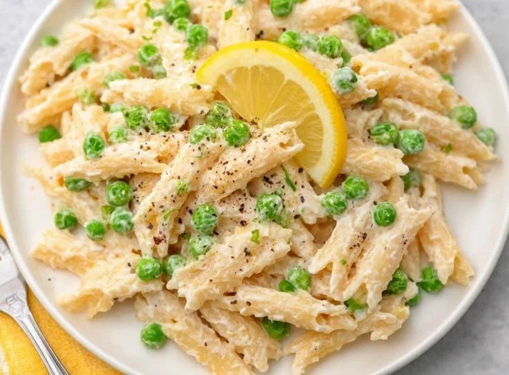 Quick Lemon Ricotta Pasta in a bowl with fresh herbs and lemon zest